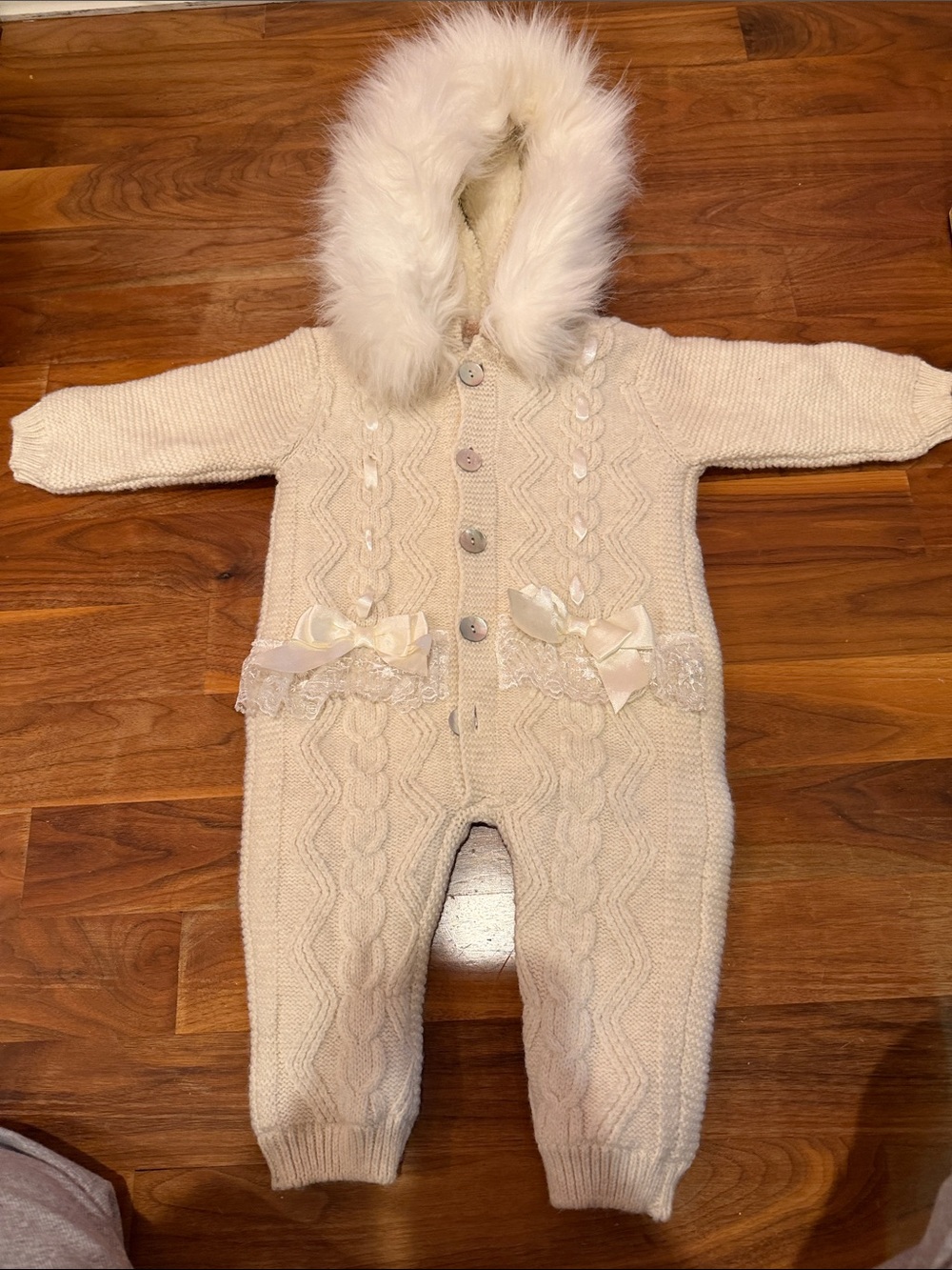 Cozy Cream Knit Hooded Baby One-Piece with Faux Fur Trim